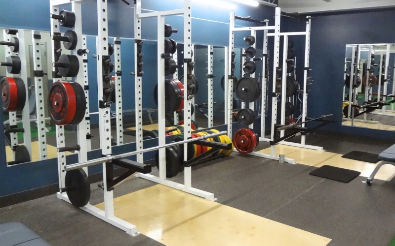squat racks for strength training and free weights at a furlong cornerstone health and fitness center