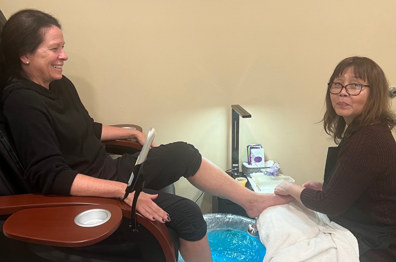 a nail technician gives a pedicure at a doylestown spa near me