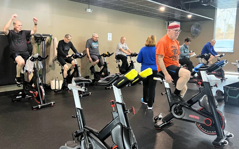 gym members use spinning machines during a parkinson's fit medical fitness class at a doylestown gym