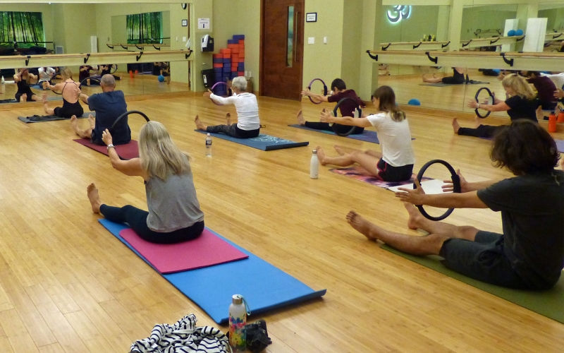 members enjoying spacious yoga studio at cornerstone in new hope
