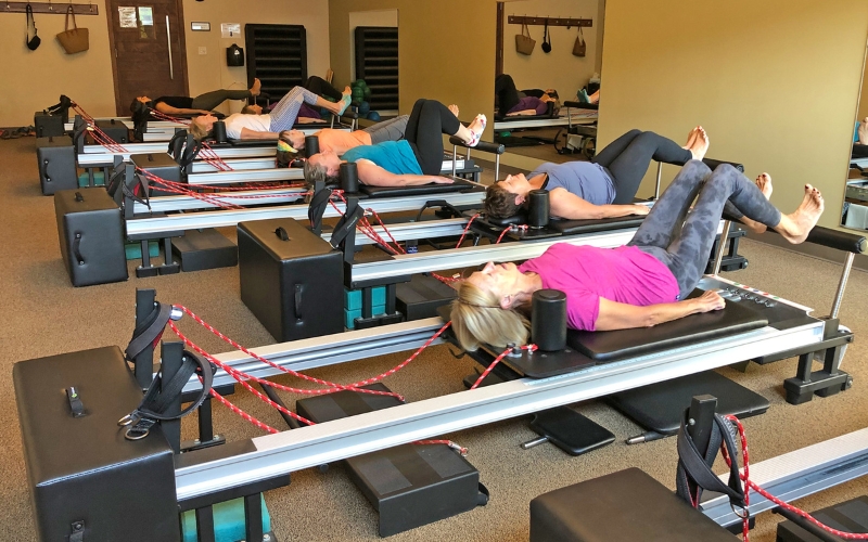 members enjoying pilates reformer classes in new hope cornerstone gym