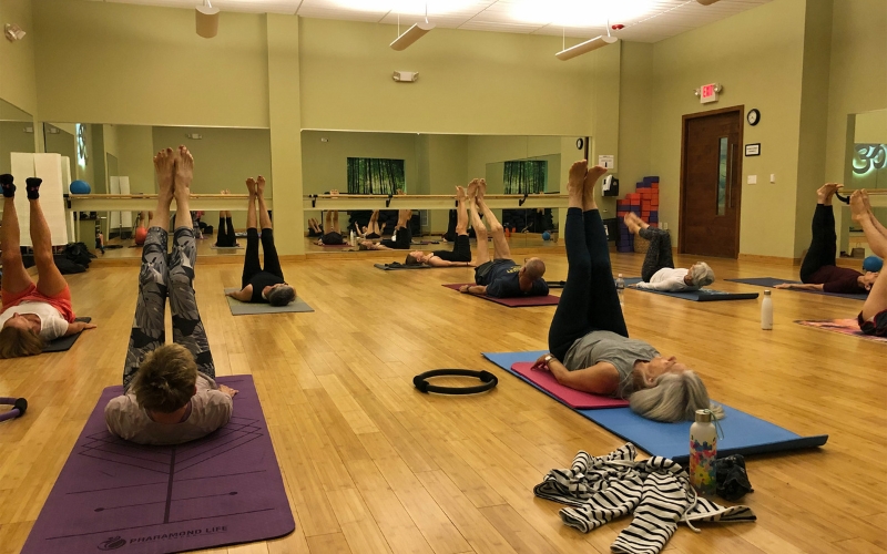 members stretching in yoga class gym in new hope cornerstone