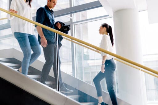 People using the stairs in the office