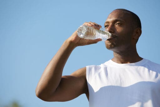 Man drinking a bottle of water