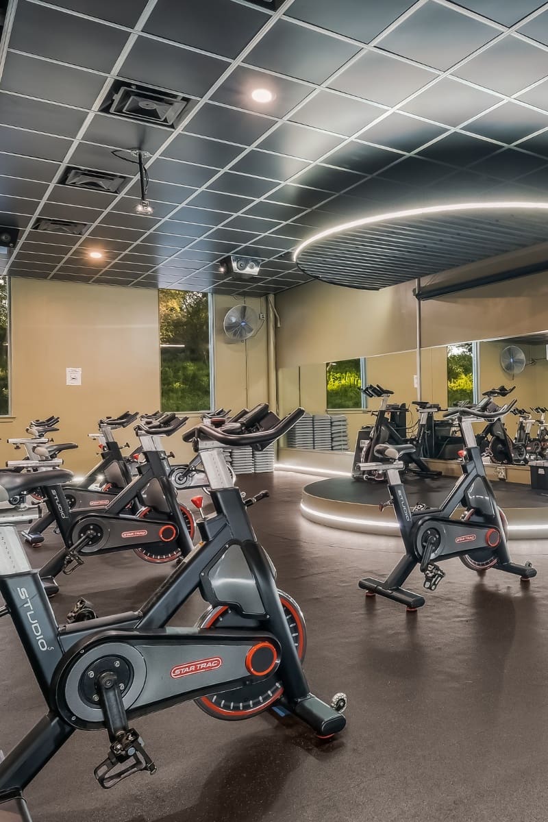 a spacious and private spinning studio for group fitness at a modern gym in buck's county