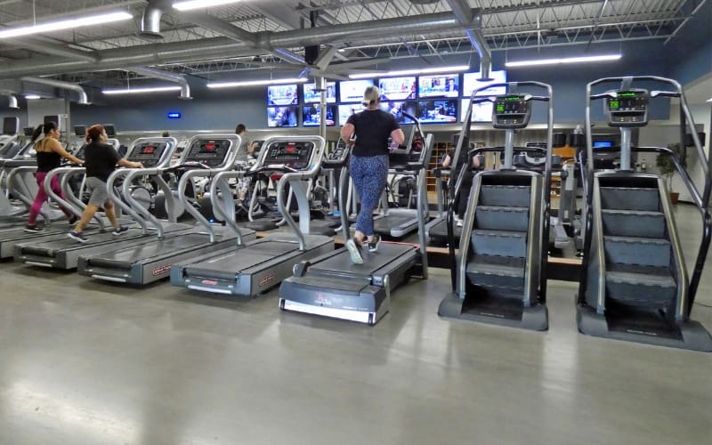 gym members work out in a modern and spacious cardio area at a buck's county gym