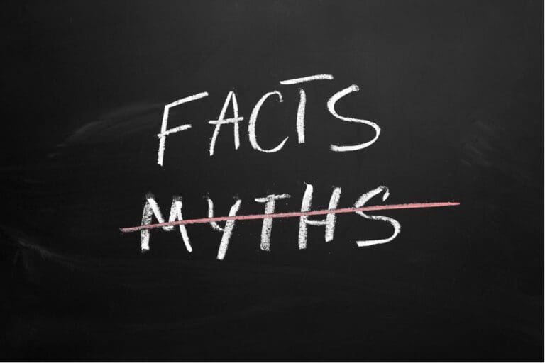 Facts versus myths written on a chalkboard.