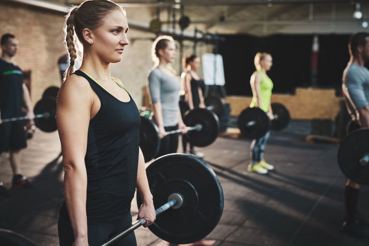 People lifting barbells.