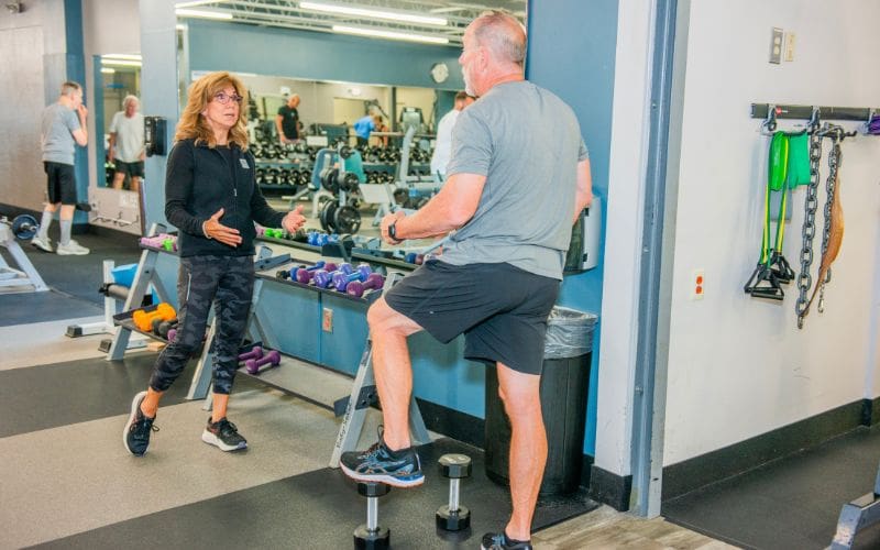 Cornerstone fitness professional guides a member through a balance assessment during a complimentary fitness consultation in Bucks County