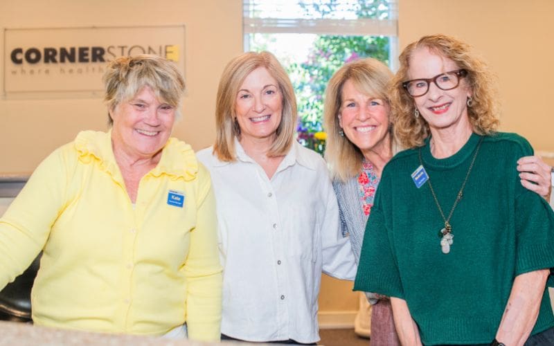 Cornerstone Health & Fitness team members welcome guests at the front desk